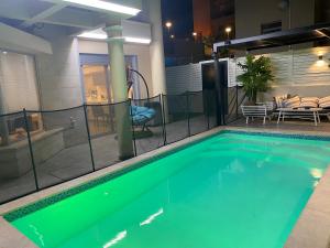 a swimming pool in the middle of a house at Luxury Duplex With Private Pool in Eilat