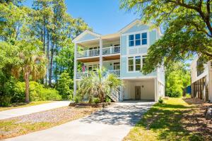 a large white house with a driveway at Salty Crab by Oak Island Accommodations in Oak Island