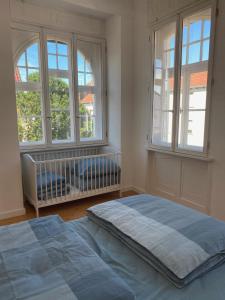En eller flere senge i et værelse på Traumhaft wohnen in Jugendstilvilla