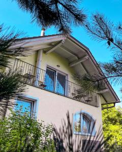 a building with a balcony on top of it at Villam Apartment in Maribor