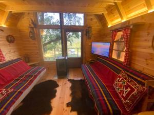 A television and/or entertainment centre at Tara Place - Camp Rabrenovic