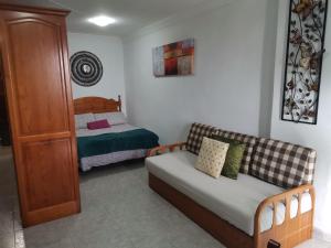 Postel nebo postele na pokoji v ubytování Acogedor Apartamento en Playa San Marcos, Icod de los Vinos