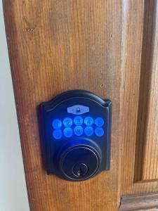 a close up of a remote control on a door at Nearby Beach House in El Segundo