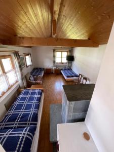 Letto o letti in una camera di Gasthaus Beverin