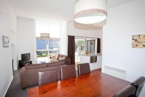 a living room with a couch and a table at Ski Time in Methven