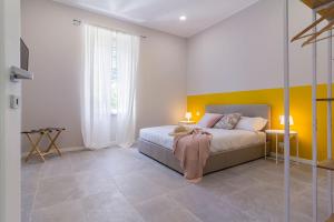 A bed or beds in a room at Luce Marmore