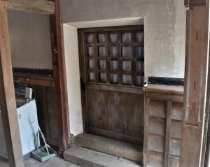 an entrance to a room with a wooden door at Guest House Miei - Vacation STAY 87547v in Nagahama