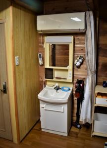 a small bathroom with a sink and a mirror at Guest House Miei - Vacation STAY 87547v in Nagahama