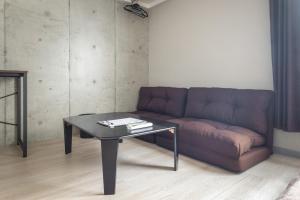 a living room with a couch and a table at Marvelous Koiwa - Vacation STAY 90819v in Tokyo