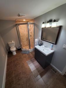 a bathroom with a sink and a toilet at Boston's Best Vacation House in Boston