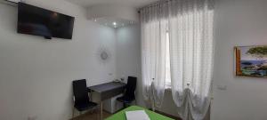 TV a/nebo společenská místnost v ubytování Vapama Rooms