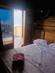 Postel nebo postele na pokoji v ubytování Palm Beach Hostal