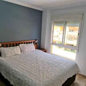 En eller flere senge i et værelse på APARTAMENTO PISCIS LITORAL + 15 billeder