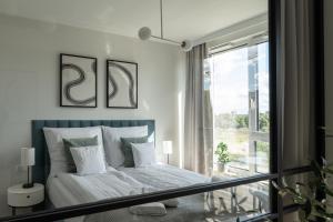 Posteľ alebo postele v izbe v ubytovaní Apartament Chlebova 315