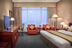 TV a/nebo společenská místnost v ubytování Beijing Hotel