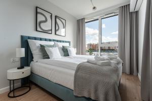 Posteľ alebo postele v izbe v ubytovaní Apartament Chlebova 315