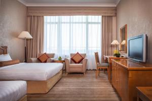 TV a/nebo společenská místnost v ubytování Beijing Hotel