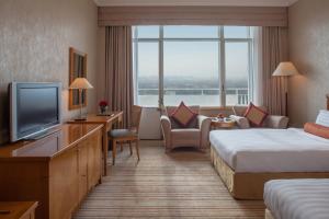 Postel nebo postele na pokoji v ubytování Beijing Hotel