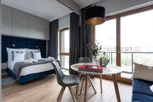 Posteľ alebo postele v izbe v ubytovaní Apartament Nadmotławie 115