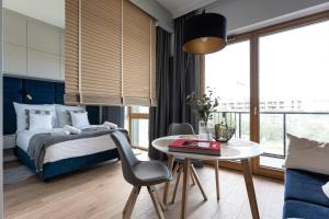 Posteľ alebo postele v izbe v ubytovaní Apartament Nadmotławie 115