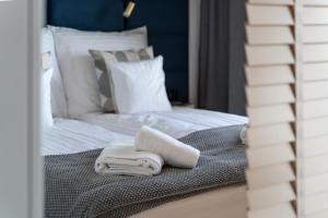 Posteľ alebo postele v izbe v ubytovaní Apartament Nadmotławie 115