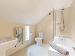 a bathroom with a sink and a toilet and a shower at Bedehouse Cottage in Matlock +19 photos
