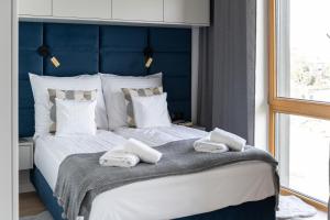 Posteľ alebo postele v izbe v ubytovaní Apartament Nadmotławie 115