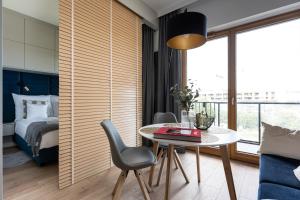 Posteľ alebo postele v izbe v ubytovaní Apartament Nadmotławie 115