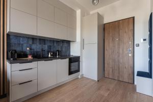 Kuchyňa alebo kuchynka v ubytovaní Apartament Nadmotławie 115