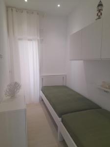 Postel nebo postele na pokoji v ubytování VILLA BELSITO