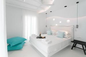 Postel nebo postele na pokoji v ubytování Majo Suites Hotel