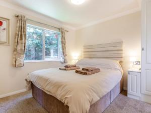 Ένα ή περισσότερα κρεβάτια σε δωμάτιο στο Elworthy Lodge