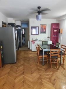 a kitchen and dining room with a table and chairs at KLM in Split