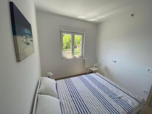 Ένα ή περισσότερα κρεβάτια σε δωμάτιο στο Apartman Aquarelle