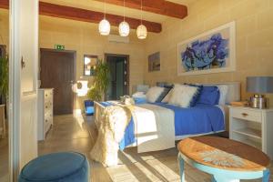 Кровать или кровати в номере Ajuga Luxury Boutique B&B
