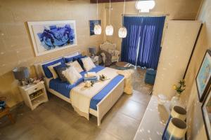 Кровать или кровати в номере Ajuga Luxury Boutique B&B