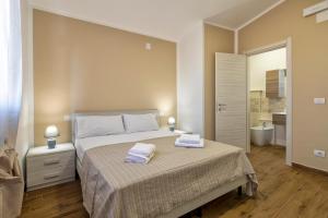 Posteľ alebo postele v izbe v ubytovaní Vico Rooms