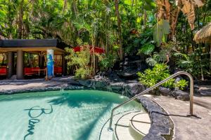 a swimming pool in front of a resort at The Bamboo Oasis at Bamboo Waikiki #307 in Honolulu