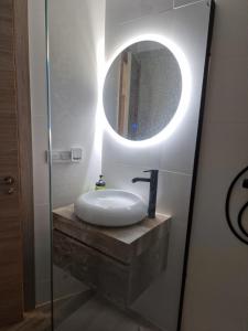 a bathroom with a sink and a mirror at Selena Beach in Cullera