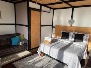 Postel nebo postele na pokoji v ubytování Balú Glamping
