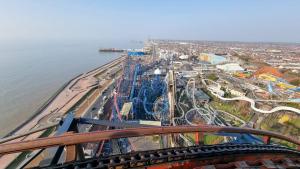 an aerial view of a amusement park with a roller coaster at Blackpool Apartments in Blackpool