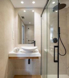 a bathroom with a sink and a shower at Hotel Boutique Berazadi Berri in Zarautz