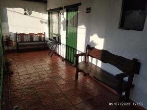 a hallway with a bench in a room at CASA VILLA LUGUIANGA Villa de Leyva in Villa de Leyva
