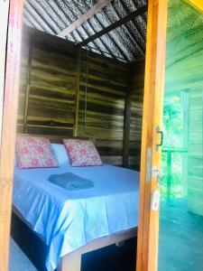 Postel nebo postele na pokoji v ubytování Palm Beach Hostal