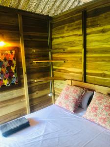 Postel nebo postele na pokoji v ubytování Palm Beach Hostal