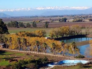 an aerial view of a river with palm trees and mountains at El Refugio de Santa Cruz in Santa Cruz