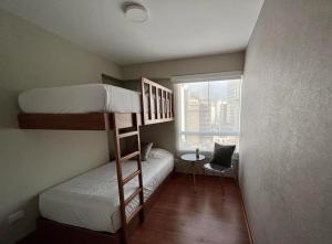 A bed or beds in a room at MLA apartments - Alcanfores