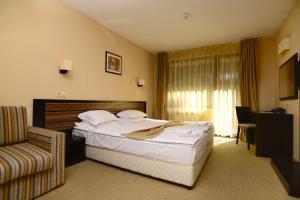 A bed or beds in a room at Hotel Mursalitsa by HMG - Half board