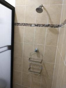 a shower with a shower head in a bathroom at Casa LUNA in La Paz