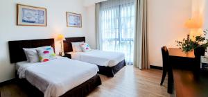 Postel nebo postele na pokoji v ubytování Diamond Westlake Suites